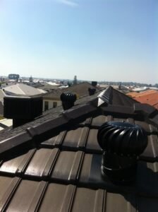 Painted whirly birds on roof