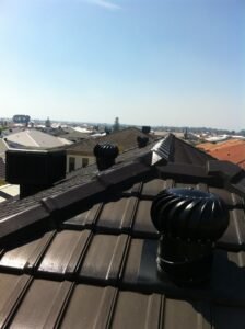 Double whirly birds on roof
